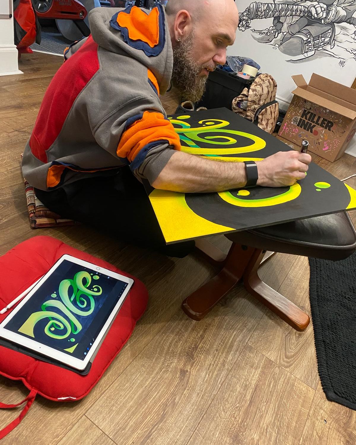 Keith working on an original painting in the studio
