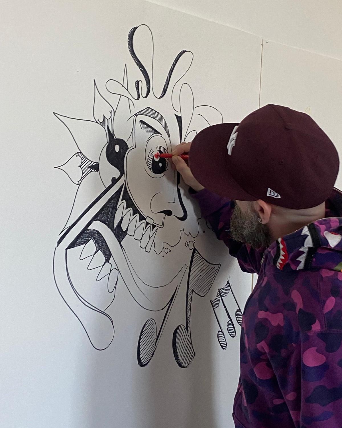 Keith working on a mural in progress